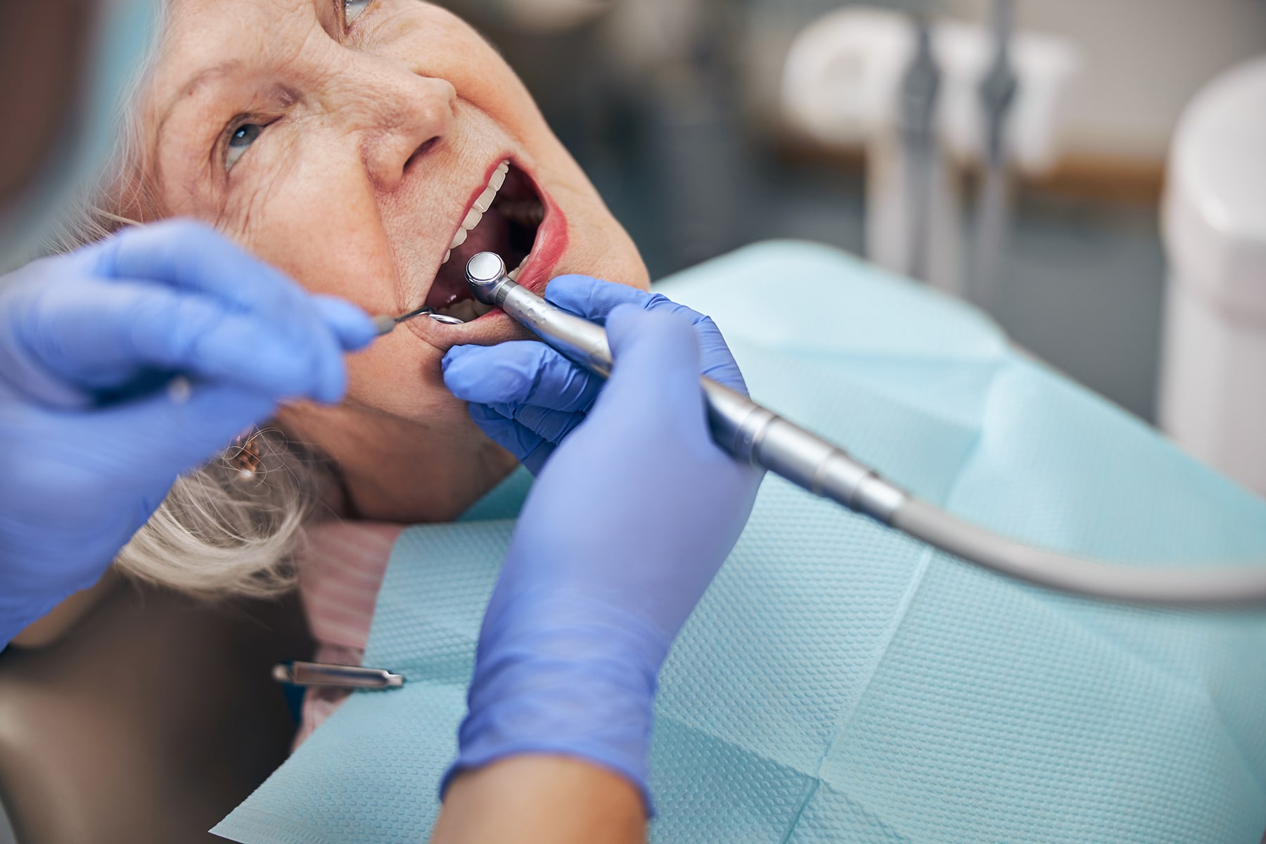 Woman getting urgent dental care in New Albany, OH