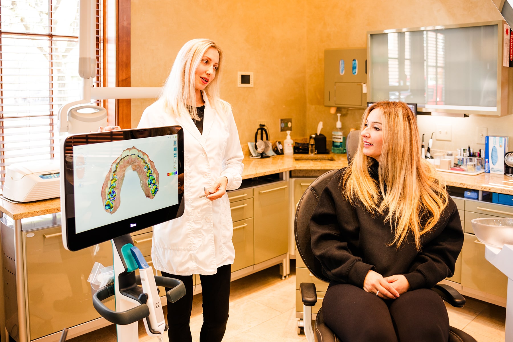 dr and dental patient talking during a dental implant consultation at new albany smiles