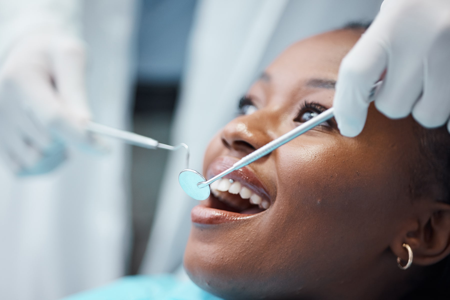 Woman at the dentist cleaning in New Albany, OH