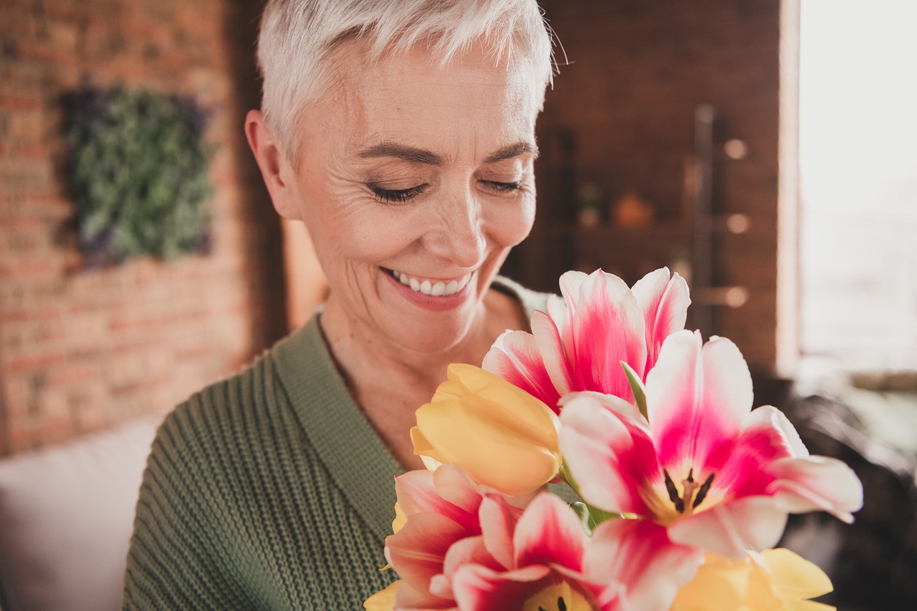 Woman smiling after teeth whitening treatment in New Albany, OH